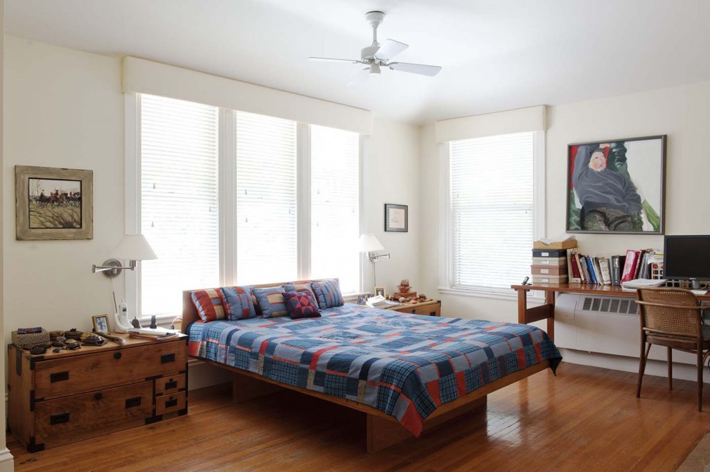 The main bedroom features a painting of Ihara by his son Akeo above a desk where Ihara's wife Doreen writes novels. Photograph by Emily Andrews. 