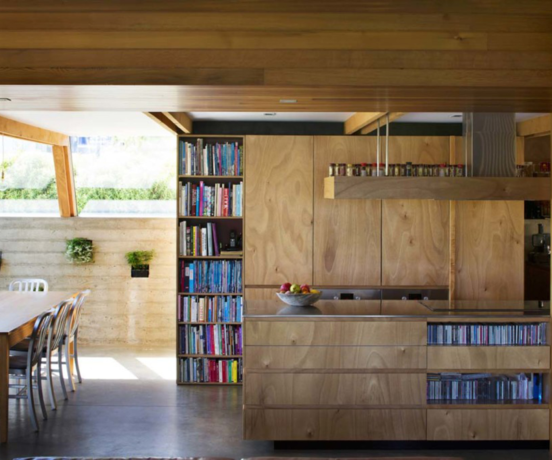 The home's ktichen is tucked under the mezzanine floor and designed to allow stirring and socialising to take place simultaneously.