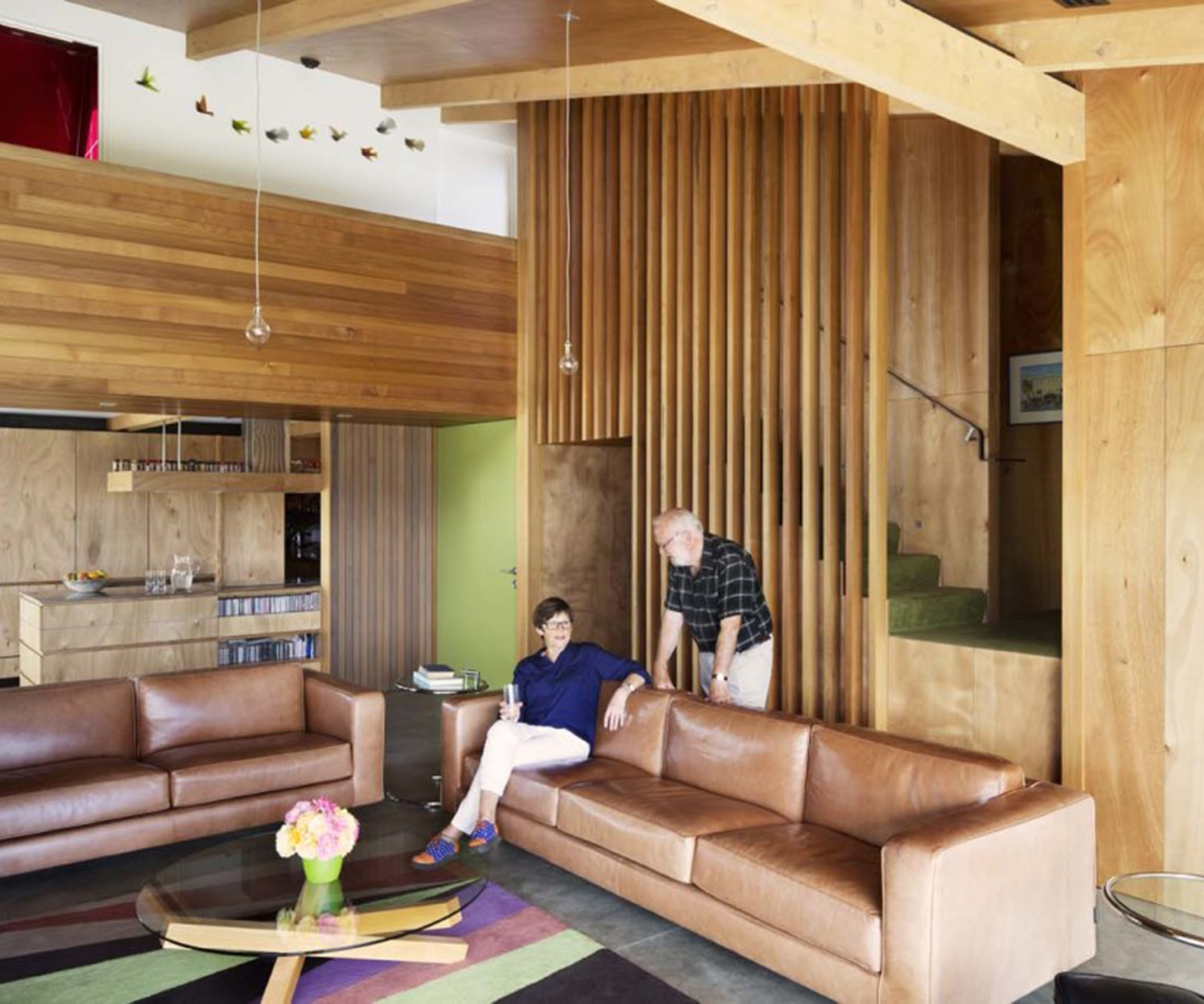 Kate and Doug Lovell in their living room. The coffee table and sofas are from Thonet. 