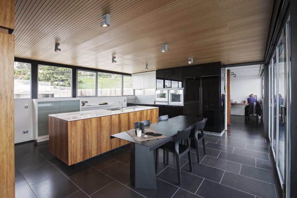 Looking through the kitchen towards the home's entrance. Photograph by Russell Kleyn. 