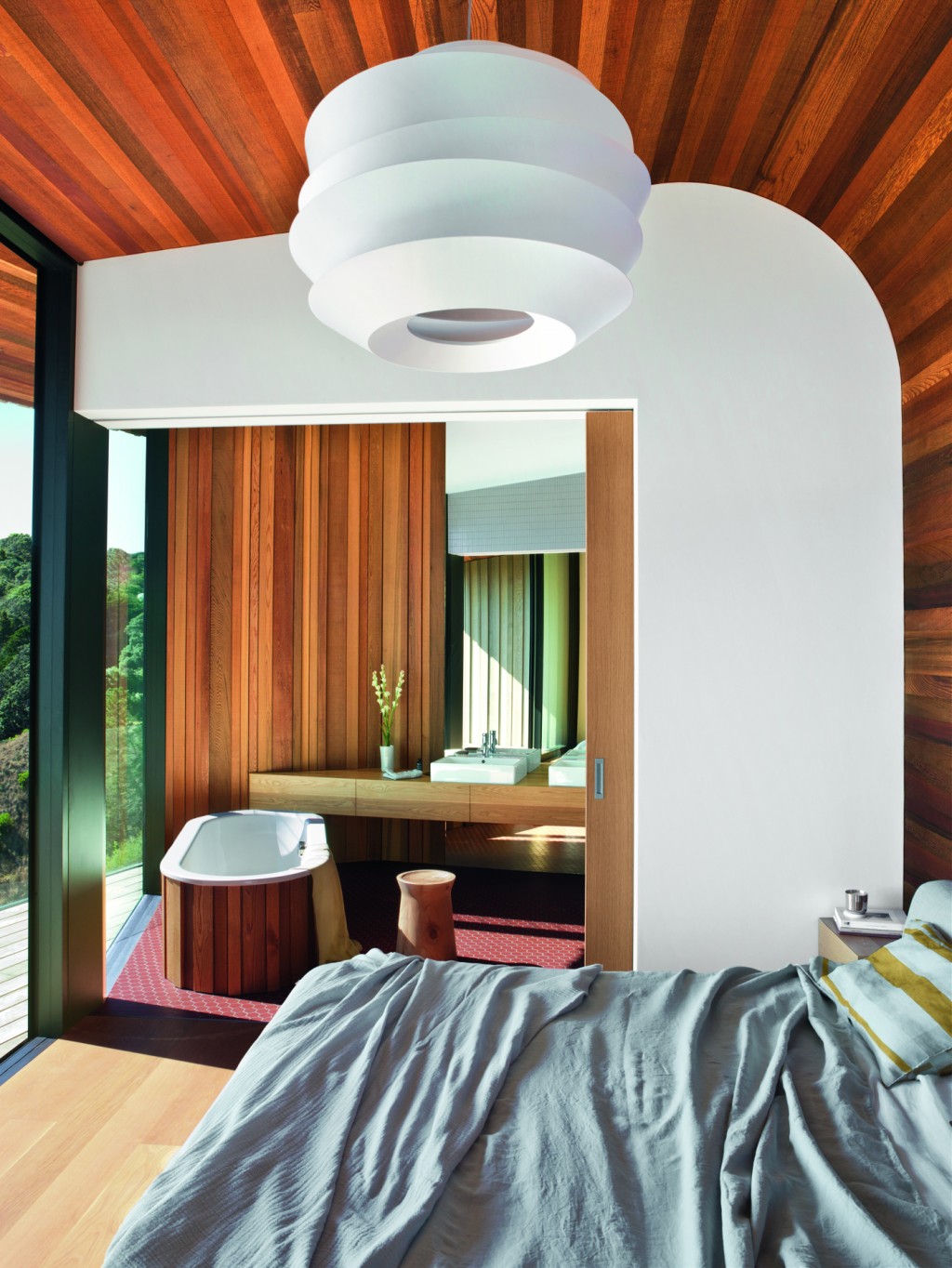 The ensuite bathroom can be separated from the bedroom by a large sliding door. Photograph by Mark Smith.