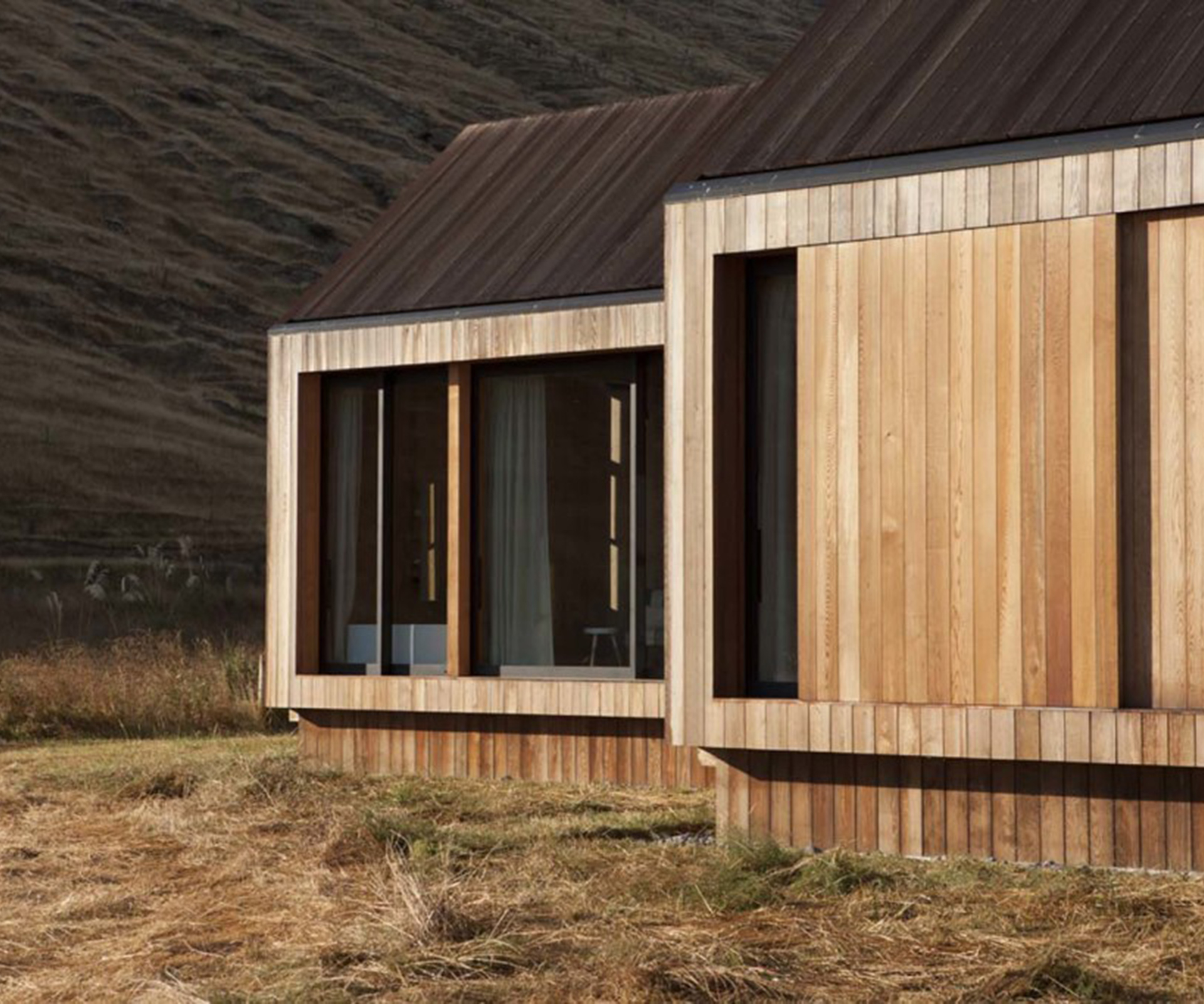 Sliding cedar panels provide shelter in bad weather. Photograph by Simon Devitt.