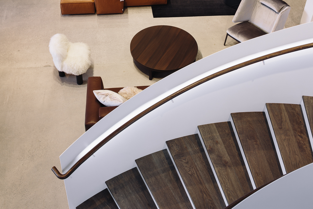 Architect Lawrence Sumich designed the showroom's interiors, including a curvaceous steel-and-oak staircase. Photograph by Simon Wilson.