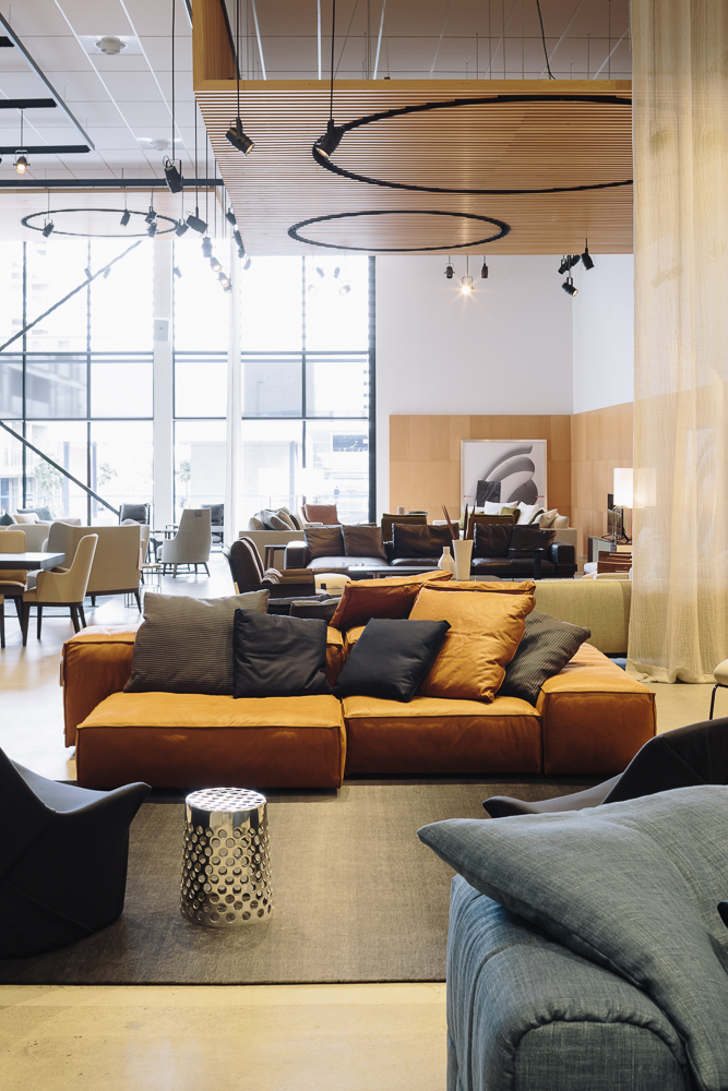 The Flexform area of the showroom features overhead timber panels designed in collaboration with Antonio Citterio's Italian design studio. Photograph by Simon Wilson.