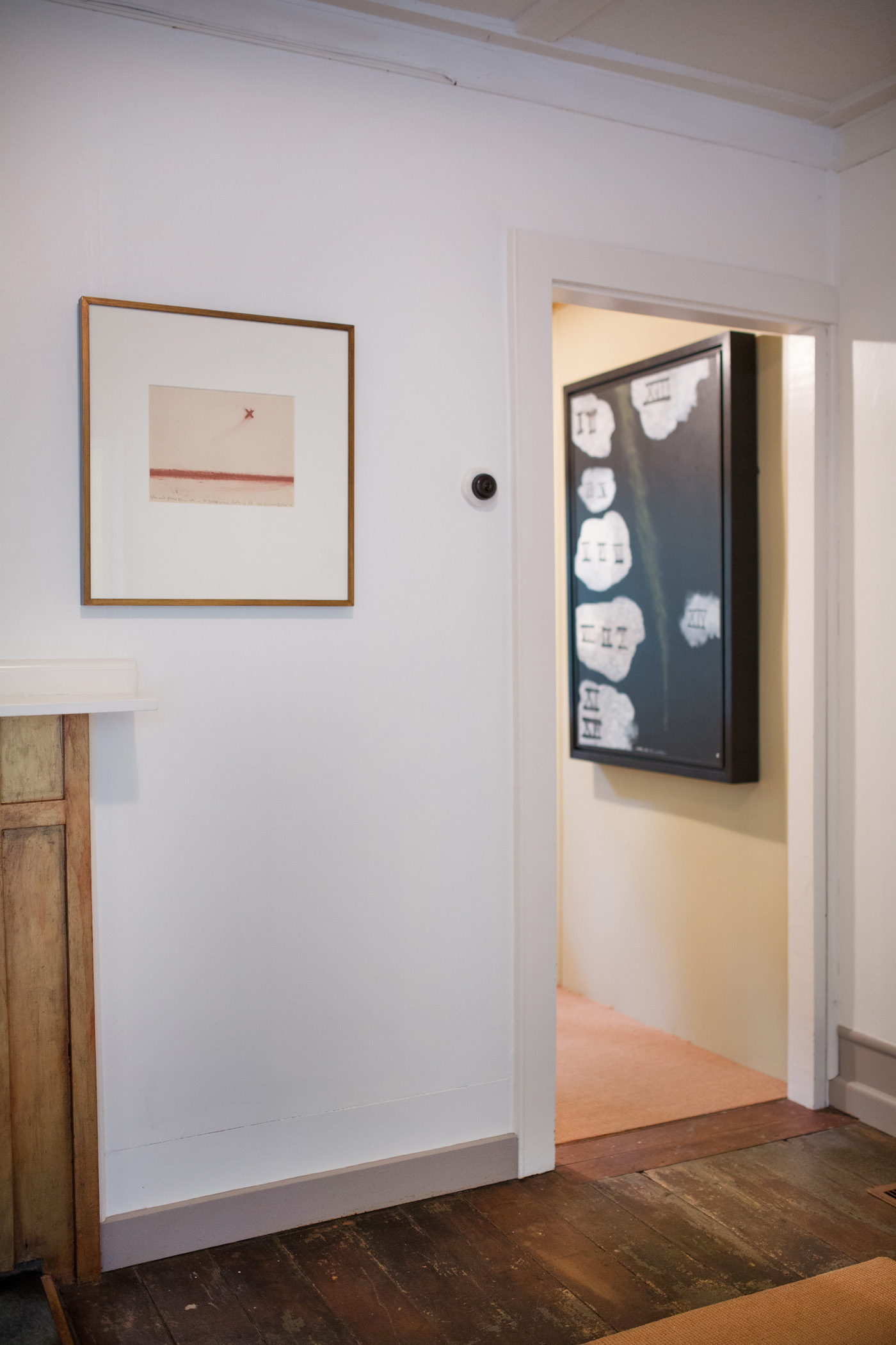 McCahon's 'Fly Out from Muriwai - it takes Some Looking at' 1973 hangs in the living room at left, while the major painting 'Clouds No. 7' (1975) is in the artist's bedroom. Photograph by Jeremy Toth.