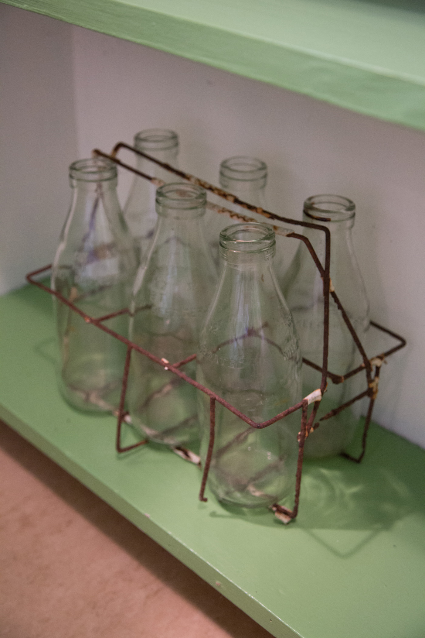 Milk bottles in a crate in the McCahon House kitchen. Photograph by Jeremy Toth.