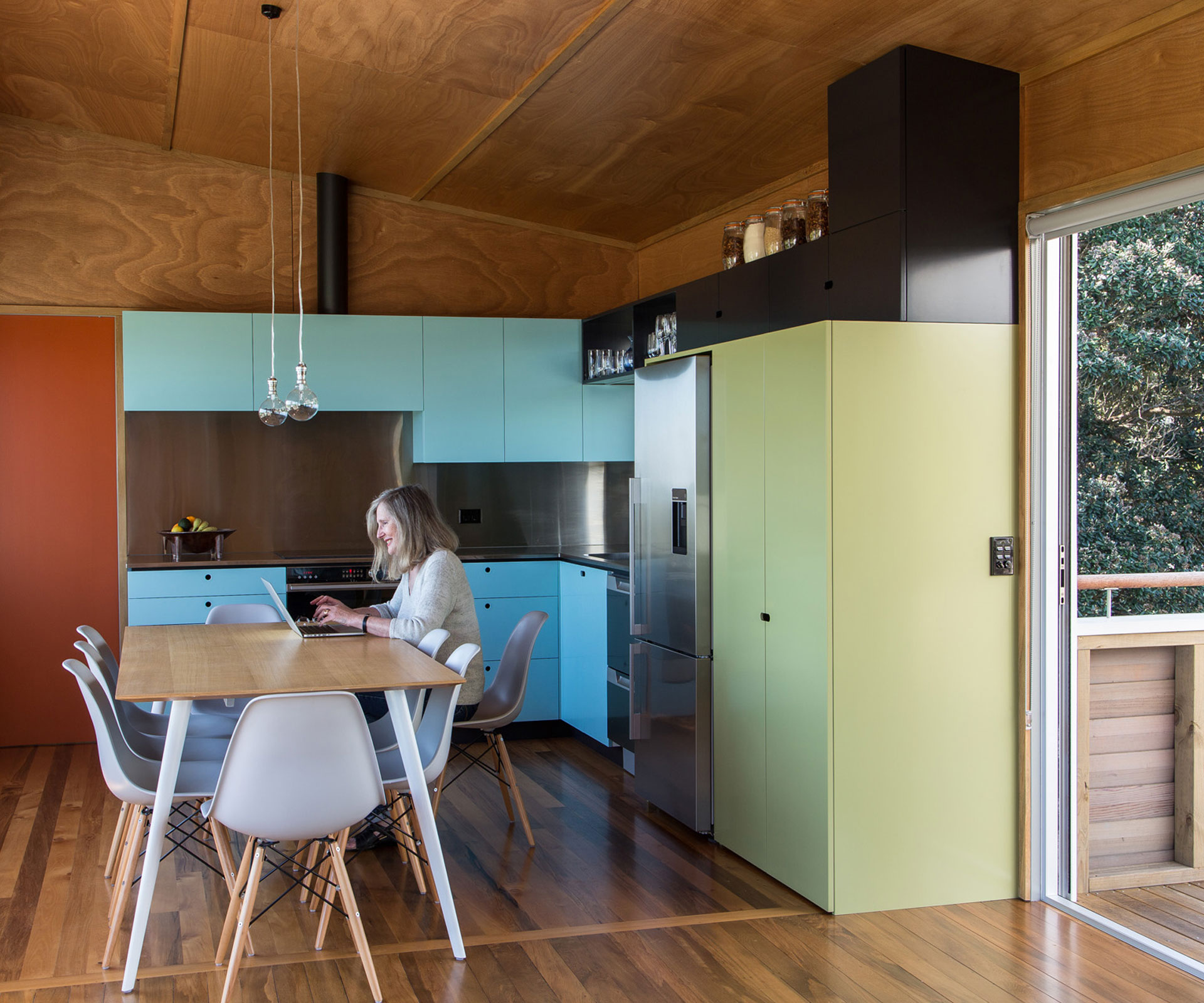 The bach's refurbished interior was brightened up with a mid-century-inspired colour palette. Photograph by Paul McCredie