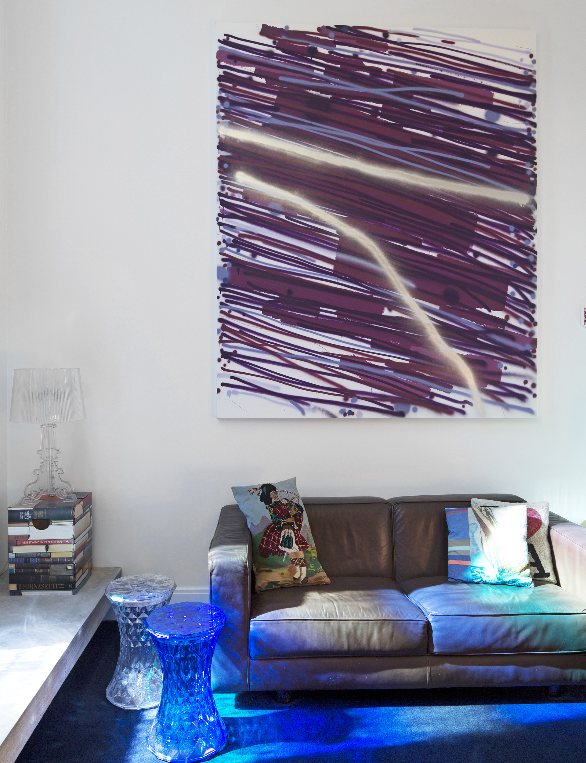 Above the ‘Longreach’ leather sofa by Neil Burley is ‘The Second Fall’, mixed media on canvas (2010), by John Reynolds. The ‘Stone’ stools by Marcel Wanders and ‘Bourgie’ lamp by Ferruccio Laviani are both from Kartell.