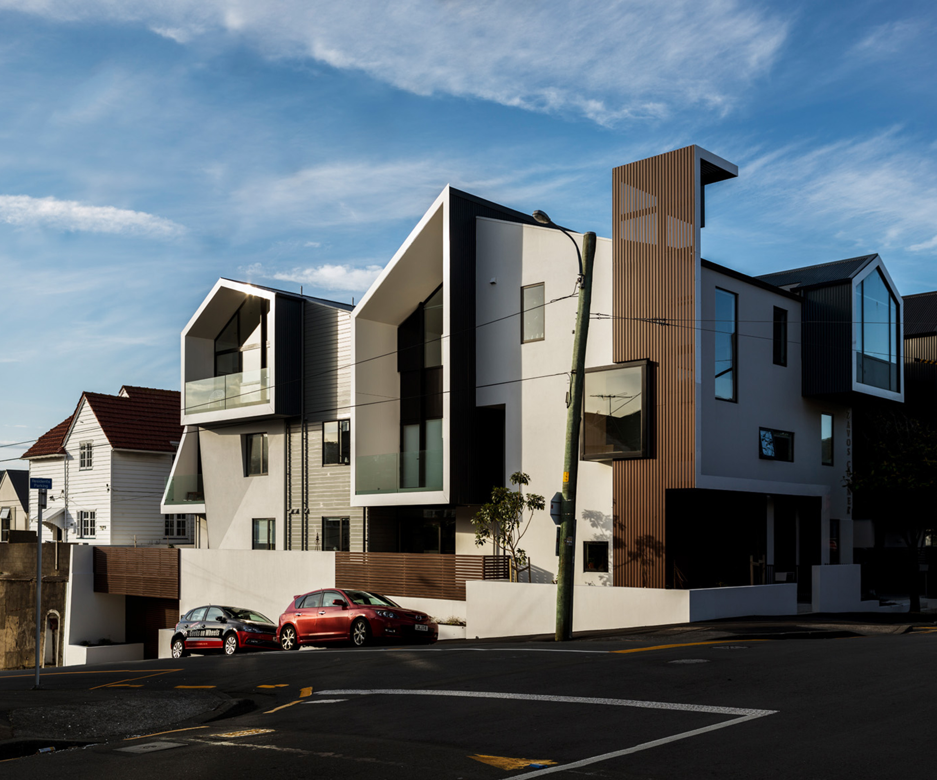 The building contains eight apartments and wraps around a prominent corner. 