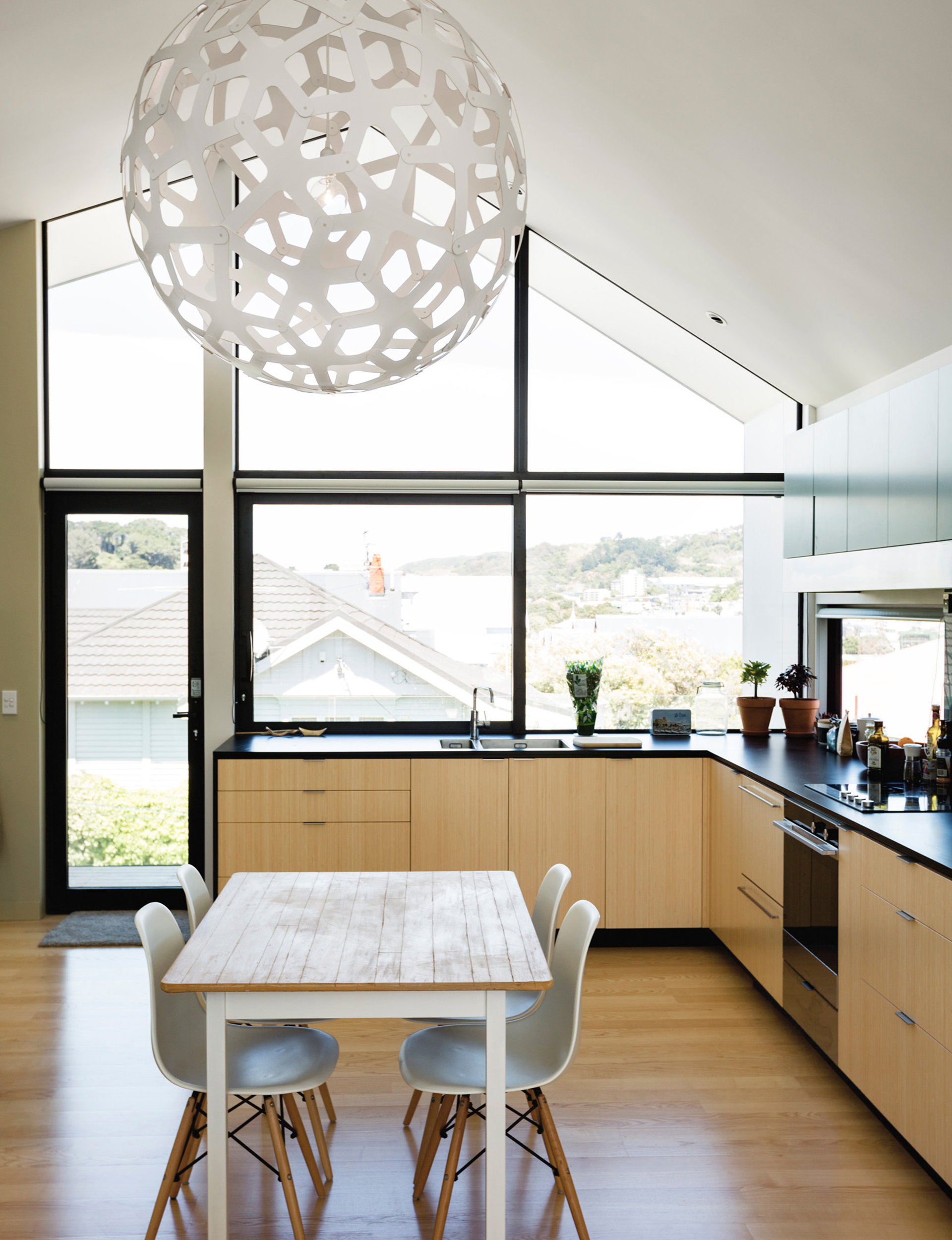 The kitchens are made up of modular elements with bamboo cabinetry. The appliances throughout are by Fisher & Paykel. 